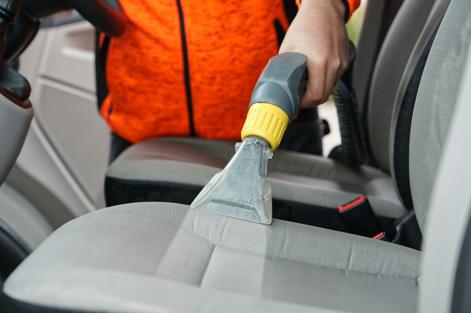 car dry cleaning. Light gray textile seats chemical cleaning with professionally extraction method.